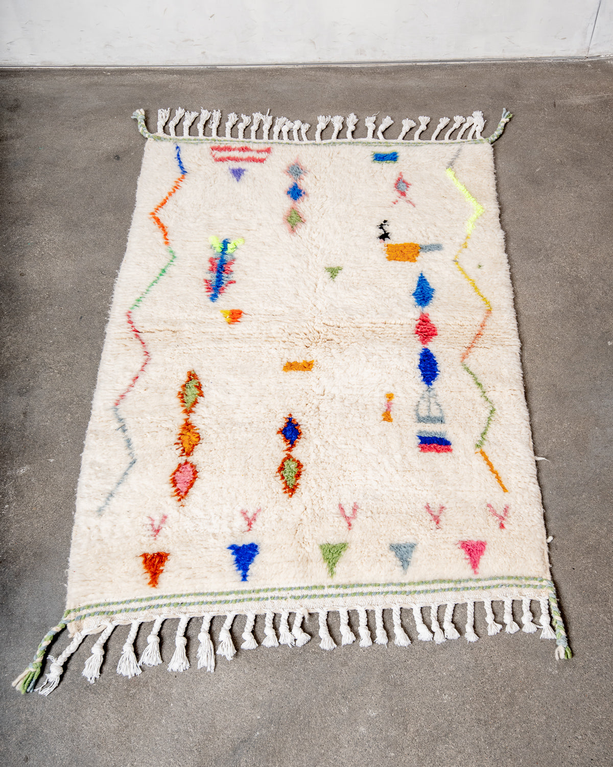Modern, designer, handcrafted Berber rug from Morocco. Beniourain carpet with beautiful colours and patterns and fluffy wool texture.